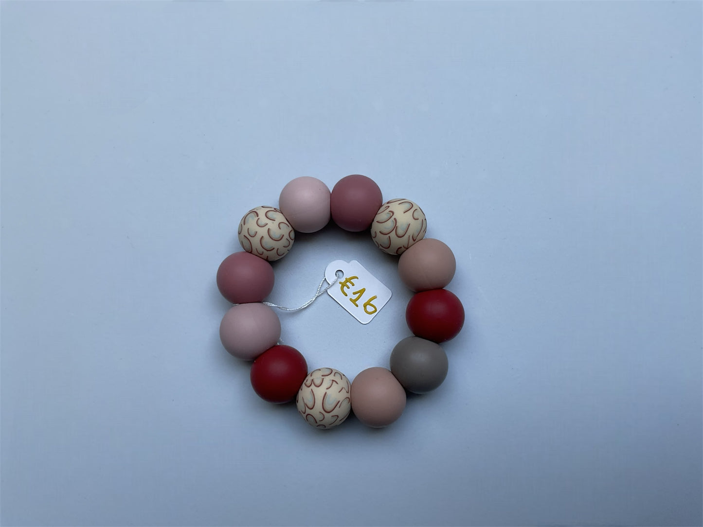 Bijtring dark pink rainbow